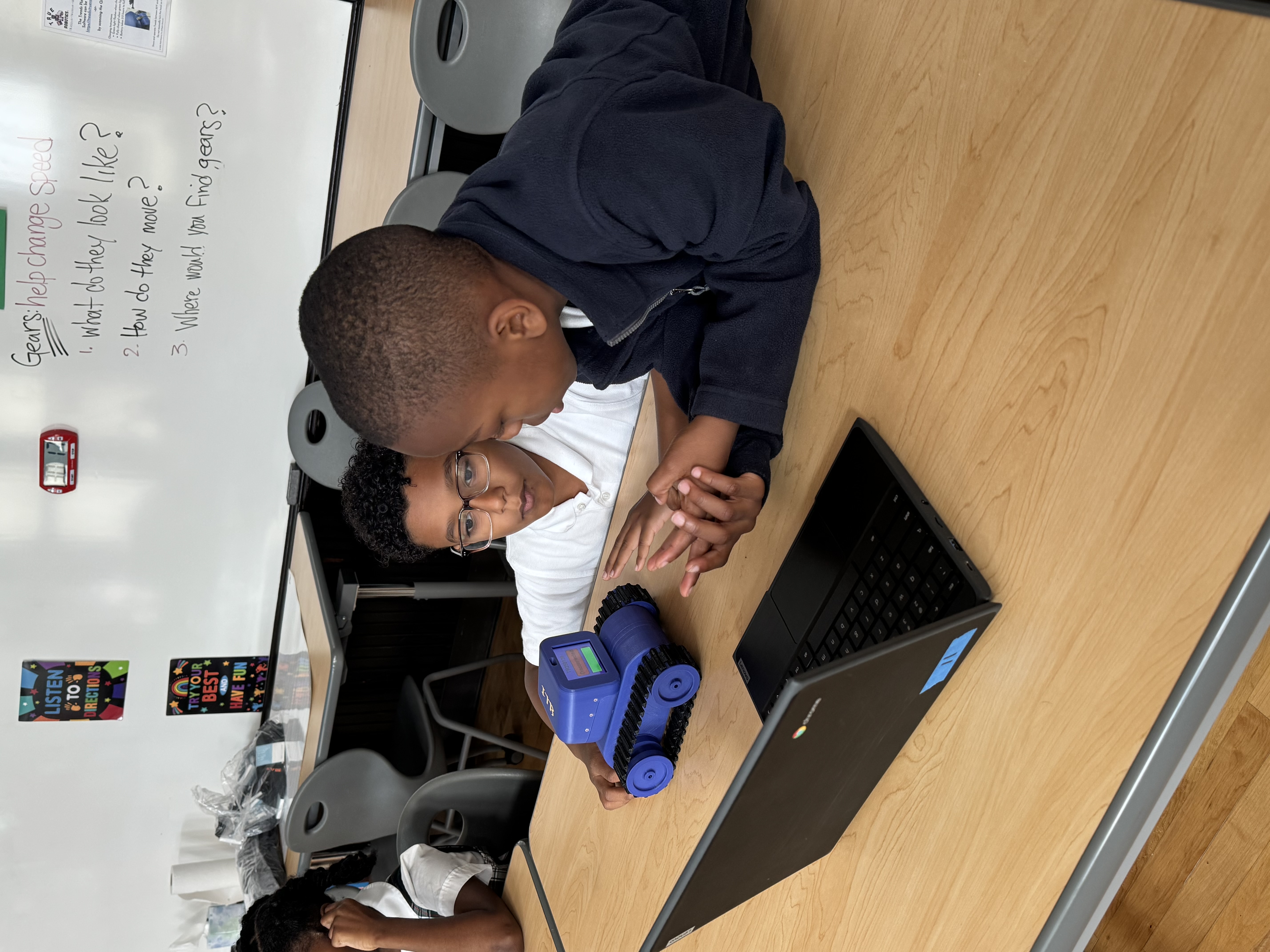 Students using True Robotics robots in the classroom